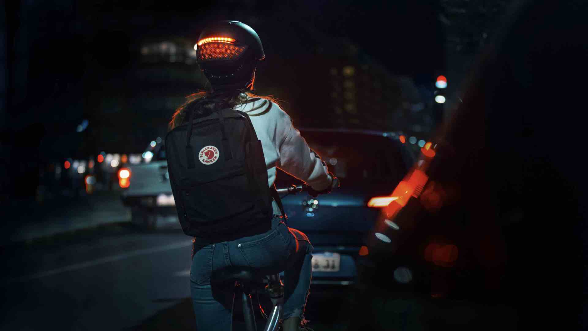 Wearing smart safety helmet at night while riding bicycle
